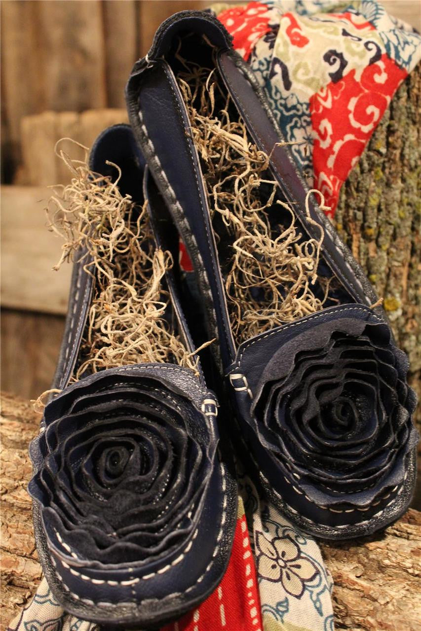 Navy leather loafer with flower rosette on toe