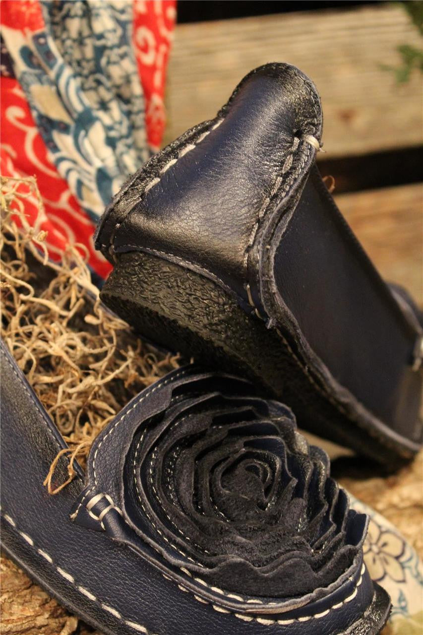 Navy leather loafer with flower rosette on toe