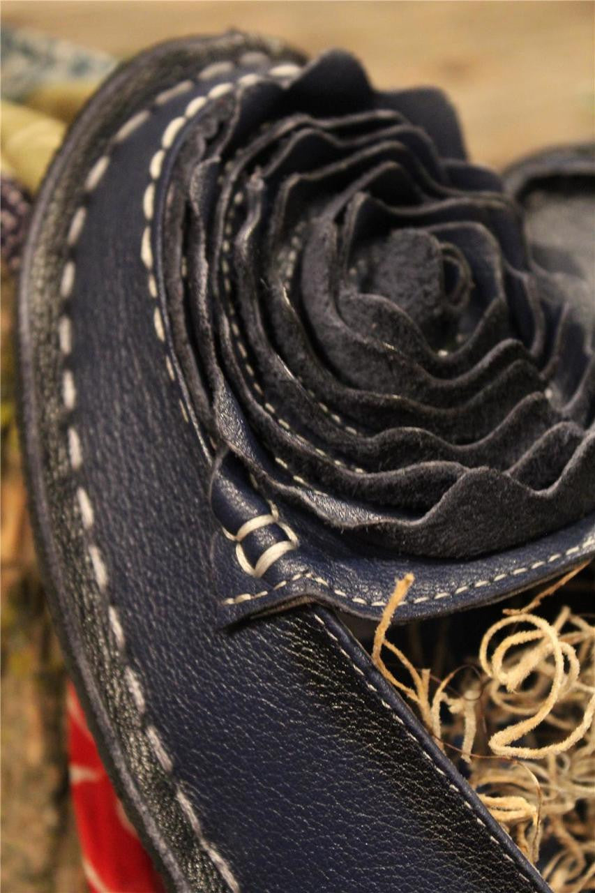 Navy leather loafer with flower rosette on toe