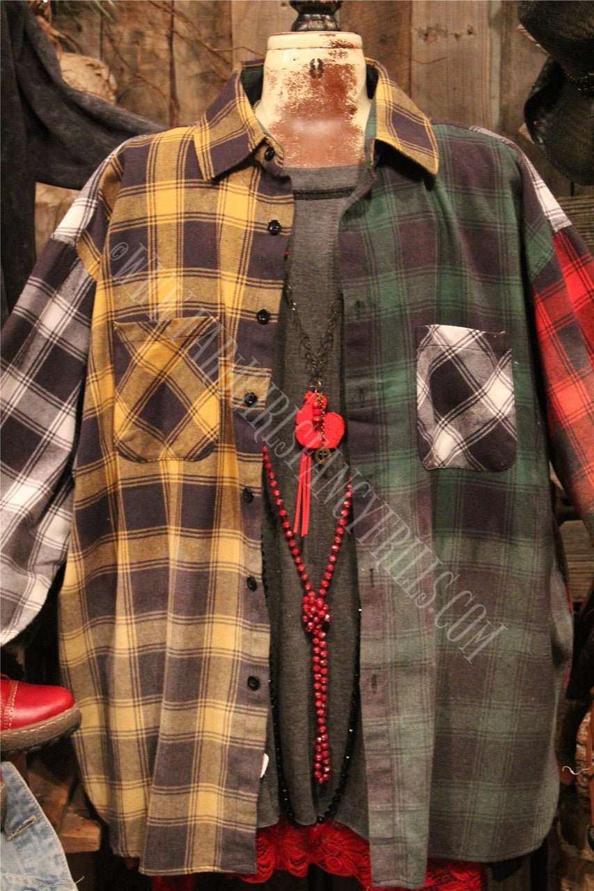 distressed flannel button up top with graphic featured on the back.