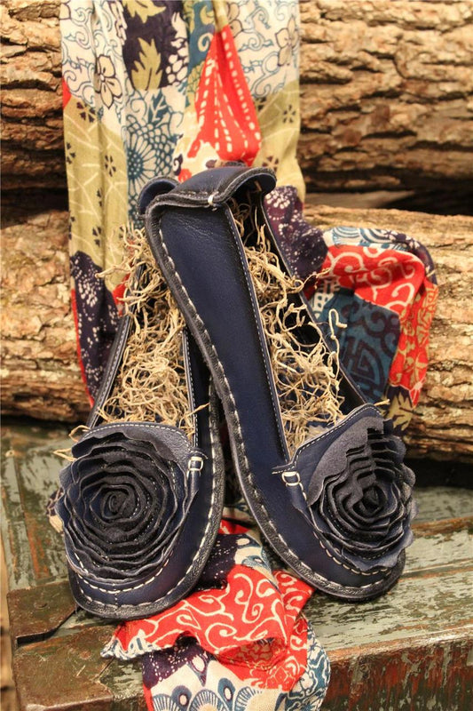 Navy leather loafer with flower rosette on toe