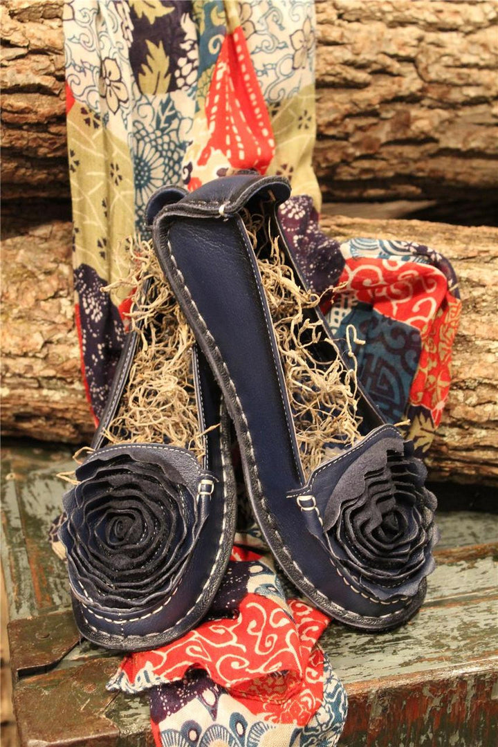 Navy leather loafer with flower rosette on toe