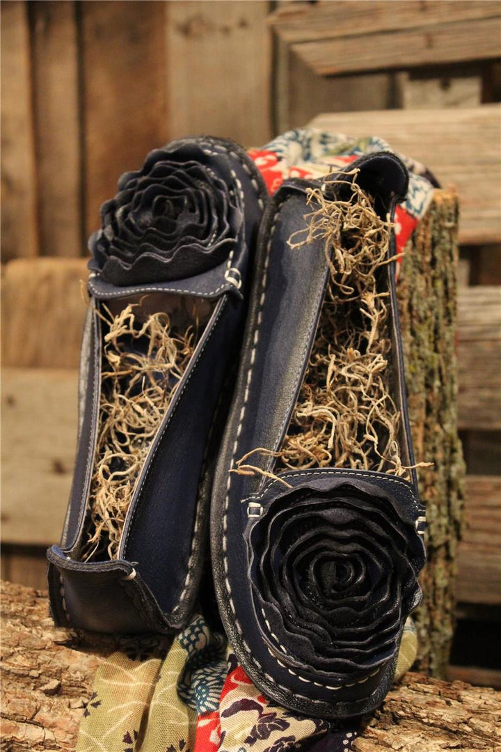 Navy leather loafer with flower rosette on toe