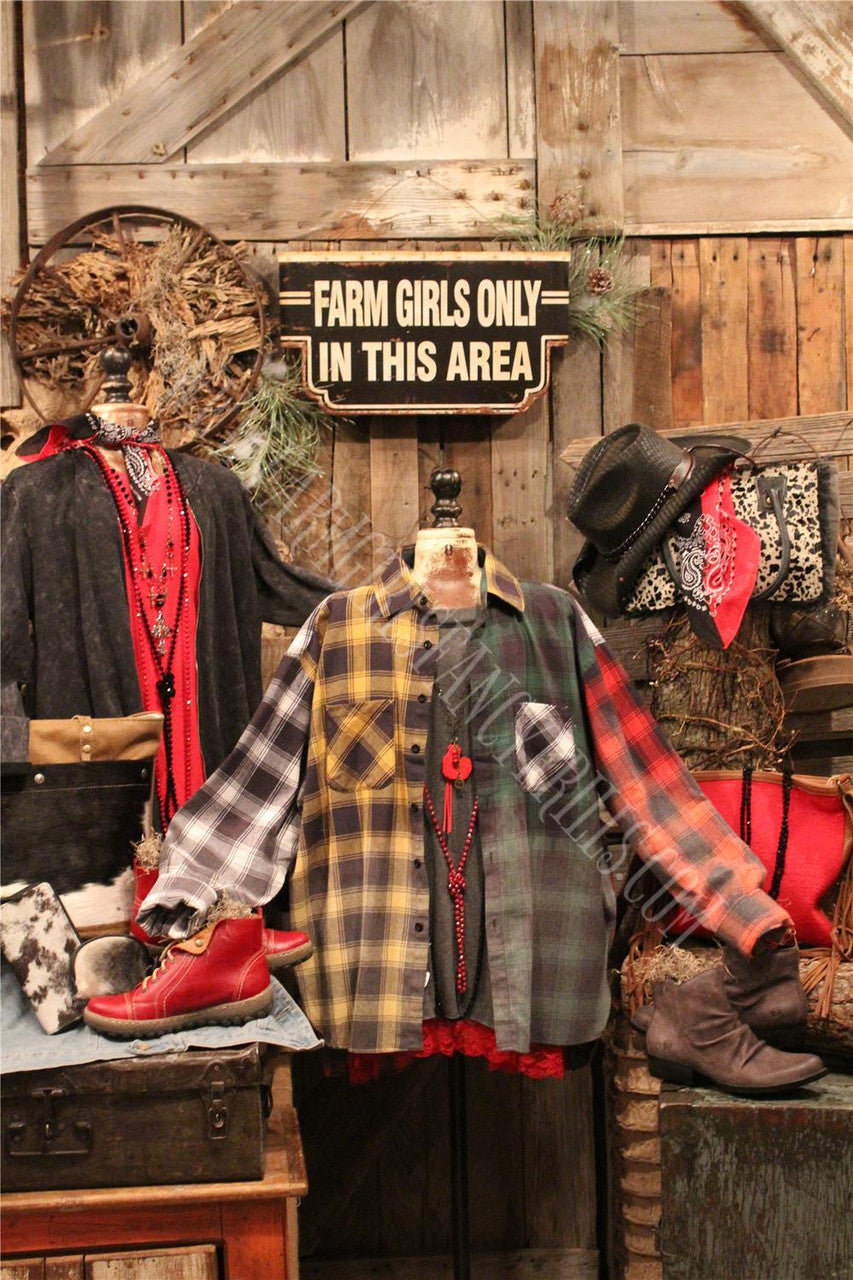 distressed flannel button up top with graphic featured on the back.