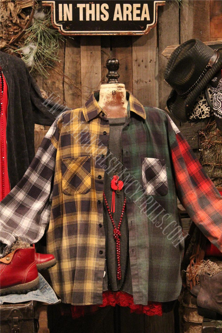 distressed flannel button up top with graphic featured on the back.