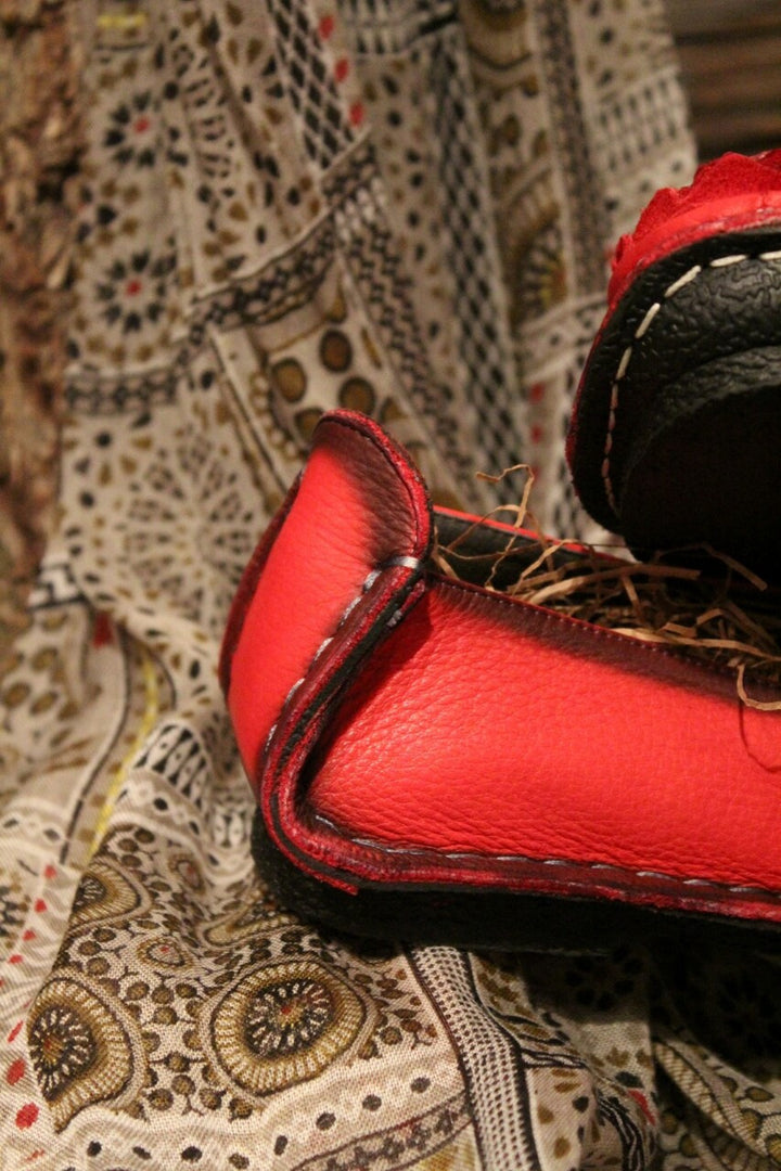 crimson red leather loafer with flower rosette on toe